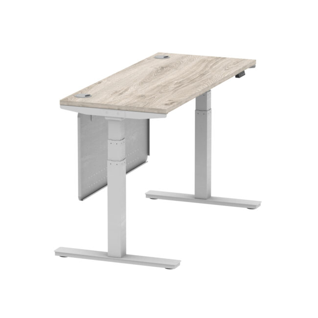 air height adjustable slimline desk with cable ports with steel modesty panel